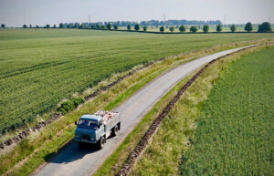 Firewood delivery truck in the Cotswolds countryside — order logs and firewood for local delivery.